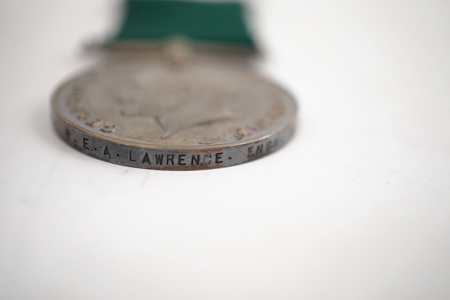 A First World War medal trio and Naval Reserve Long Service medal awarded to R.E.A. Lawrence ENGN RNR. Condition - fair.